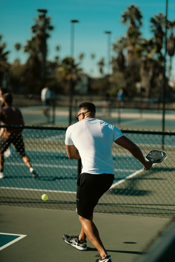 a-man-holding-a-tennis-racquet-on-a-tennis-court-esvvzam4hvm